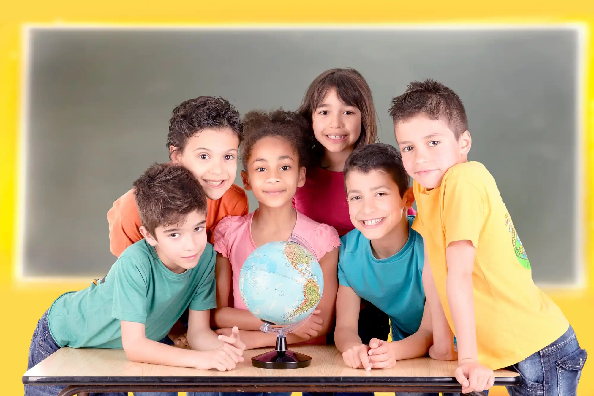 group photo of 6 children with a globe placed in front of them